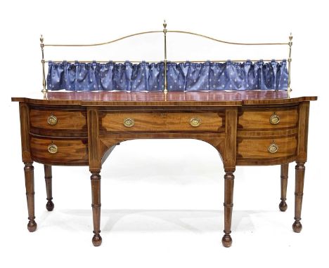 A 19th Century mahogany breakfront sideboard, tubular brass raised back with urn finials, rosewood crossbanded and strung wit