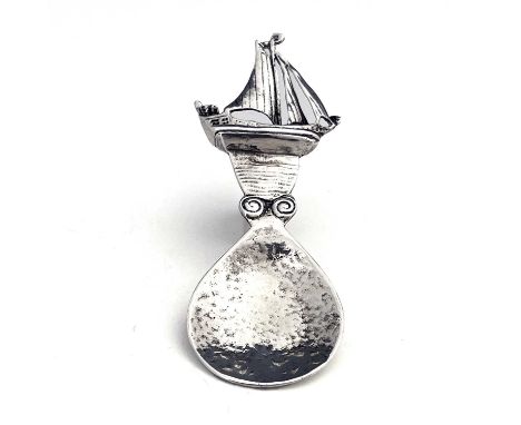 Alexander Ritchie, an Arts and Crafts Iona silver caddy spoon, assay marks Shipton and Co., Chester 1945, the pear shaped pla