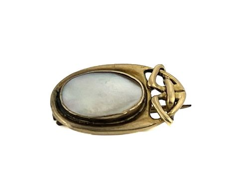 Archibald Knox for Liberty and Co, an Arts and Crafts gold and blister pearl set brooch, model 1288, circa 1903, the oval pla