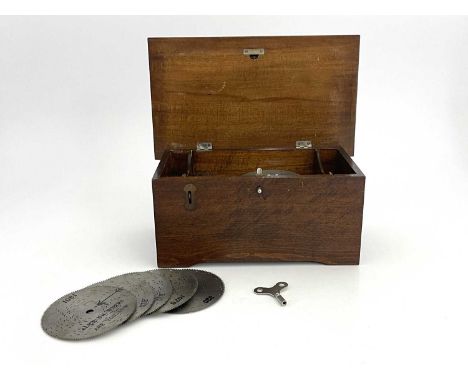 Musical Instruments, a tabletop polyphon, late 19th Century/early 20th Century, wooden case with a painted Jugendstil device 