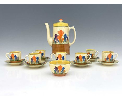 Clarice Cliff for Wilkinson and Newport Pottery, a Crocus pattern coffee set, including coffee pot, six cans and saucers, Biz