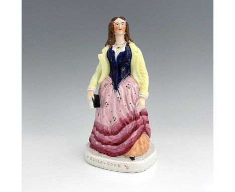 A Staffordshire figure of 'Eliza Cook', circa 1850, modelled standing female figure holding a book on a titled ovoid base, po