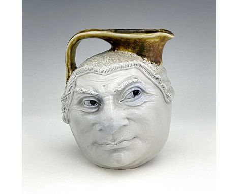 Robert Wallace Martin for Martin Brothers, a stoneware characterful Barrister face jug, circa 1910, modelled to each side wit
