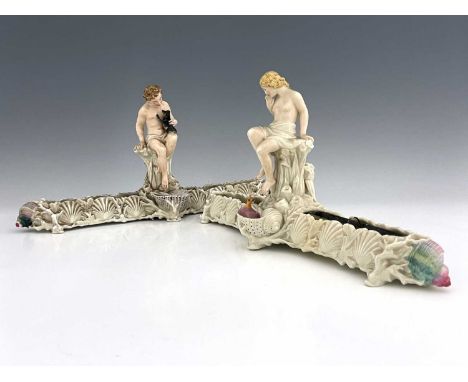 A pair of Royal Worcester pearlescent lure figural centrepiece vases, each with a nymph type figure on a rocky outcrop, flank