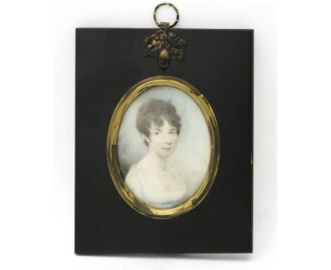 An early 19th century portrait miniature, painted to depict a young woman with cropped hair in empire line dress, on ivory, 5