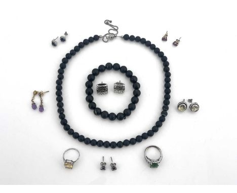 A collection of gem set jewellery, including a citrine ring and earring set, sapphire and ruby earrings etc