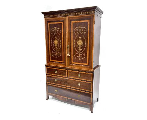 An Edwardian mahogany linen press, circa 1910, dentil cornice, twin panelled doors, satinwood crossbanded, strung and marquet