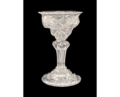 A diamond moulded sweetmeat glass, circa 1740, the double ogee bowl with optic diaper lattice, on a compressed ring collar, i