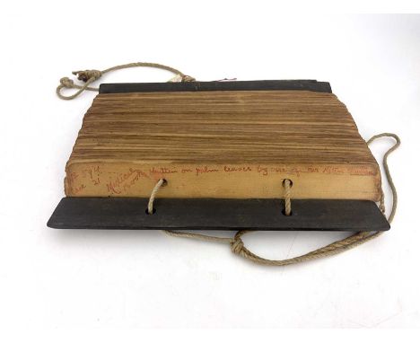An early Indian Tamil script palm-leaf manuscript, titled in red ink 'No. 594 Case 21 Medical book written on palm leaves by 