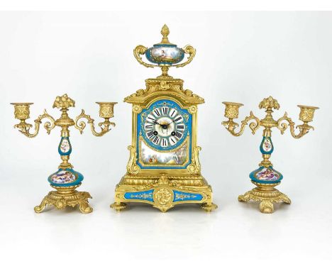 A French porcelain and ormolu mounted clock garniture, circa 1885, the chiming clock movement stamped R &amp; C paris, the cl