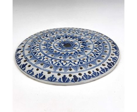 An English Deflt blue and white drainer, London, mid 18th century, circular form with concentric ring and hole decoration of 