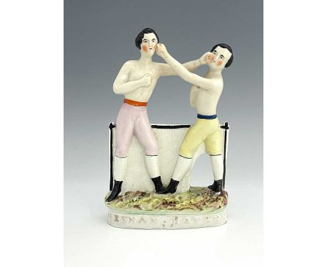 Staffordshire portrait pugilist figure group of 'Heenan' and 'Sayers, circa 1860, modelled as two shirtless boxing men, polyc
