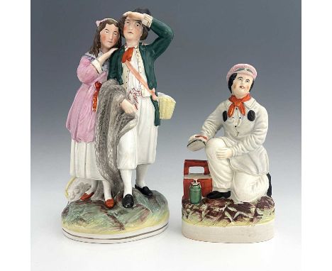A Staffordshire figure group, late nineteenth-century, 'Fisherman and Companion' figure modelled as a standing fisherman with