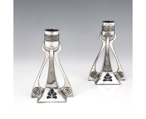 WMF, a pair of Jugendstil silver plated candlesticks, buttressed square section trumpet form, pierced with honeysuckle motifs