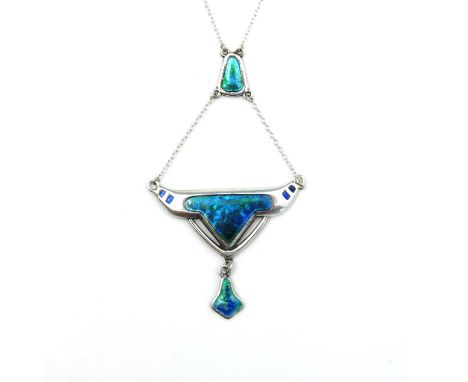 Charles Horner, an Arts and Crafts silver and enamelled pendant necklace, Chester 1909, Aztec buffalo head form with champlev