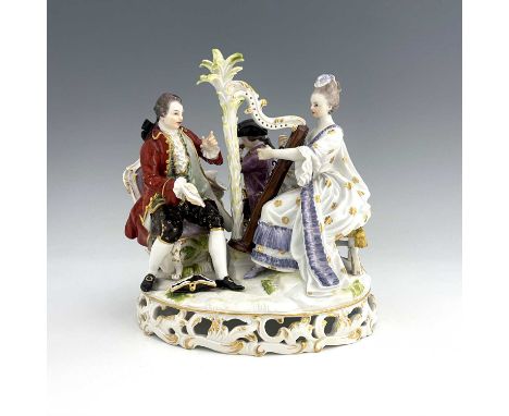 A Meissen figure group, model D48, three musicians, including harpist, on a reticulated Rococo scroll base, incised marks and