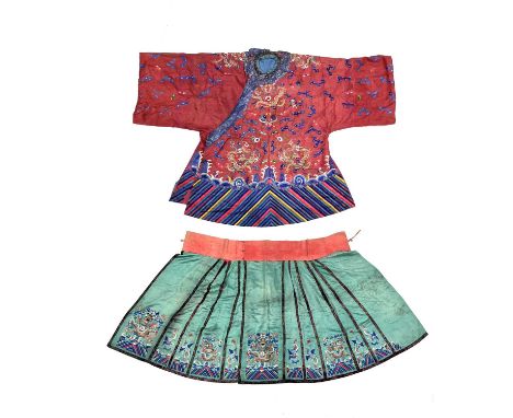 A Chinese silk embroidered skirt and overcoat, Qing Dynasty, 19th Century, the overcoat in red with dragons chasing flaming p