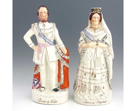 A pair of large Staffordshire portrait figures of 'The Queen' and 'The Prince of Wales', circa 1870, modelled as a crowned, s