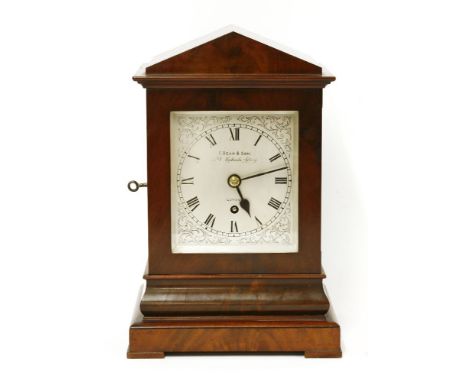 A mahogany cased bracket clock, 20th century, of architectural form, the silvered face with Roman numerals and marked 'F. Bea