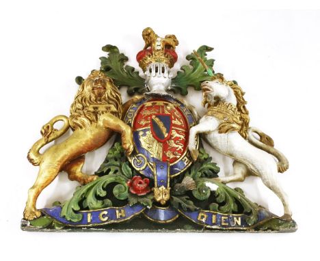 A large carved wood and gesso royal coat of arms,early 20th century, decorated in gilt and polychrome,122cm wide115cm high
