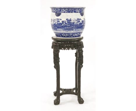 A Chinese hardwood jardinière stand with a Copeland Spode jardinière,the stand with a marble inset over a carved frieze, legs