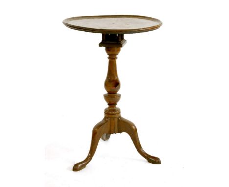 A George III mahogany tripod table,with a circular top over a birdcage, raised on a turned column and tripod stand, 46cm diam