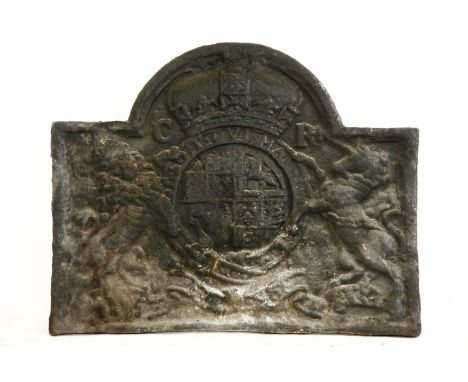 A very large cast iron fireback, with an arched top with the royal coat of arms, 102cm wide81cm high