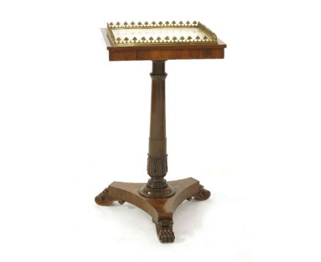 A Regency rosewood lamp table,the square top with a marble inset within a gilt metal gallery, the turned column with carved s