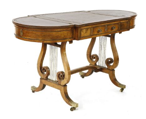 In the manner of Gillows of Lancaster, a good George III rosewood sofa backgammon table,the leather lined top with rounded en