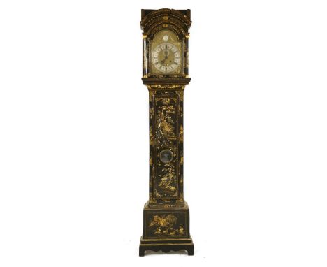 A George III black lacquered longcase clock, the arched dial inscribed 'Thos Tron, London', beneath a crown head by cherubs, 