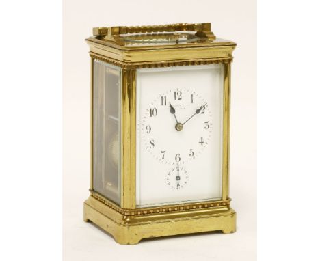 A French brass carriage clock, late 19th century, with repeat and alarm mechanisms, and striking the half hours on a gong, ba