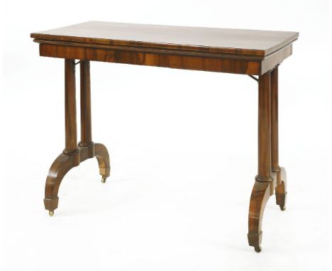 A coromandel(?) card table, 19th century, with patent action, the top opening and swivelling, the two pairs of legs move in t