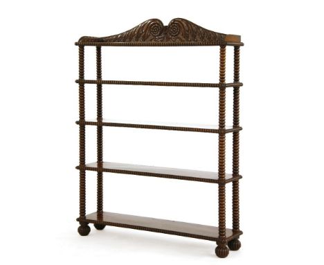 A George IV mahogany four-tier open bookshelf,with a scrolled carved pediment and gallery over bobbin turned supports,93cm wi