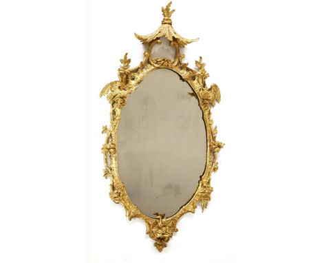 A Chippendale period carved giltwood wall mirror,the crest with a raised arbour and two ho-ho birds over two plates within or
