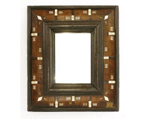 A Continental wall mirror, late 17th century, with bone inlaid cushion frame, later glass, 46cm wide40cm high