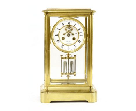 A French brass regulator mantel clock, late 19th or early 20th century, the bevelled glass sides within a brass framework on 