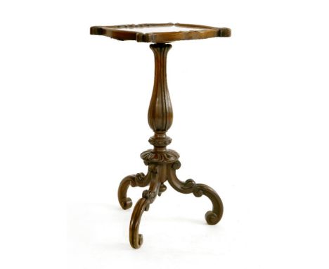 A rosewood lamp table,19th century, the shaped rectangular top centred with embroidered panels over a turned and carved colum