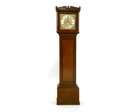 A George III oak longcase clock,the brass dial with a silvered chapter ring with a subsidiary seconds dial and calendar apert