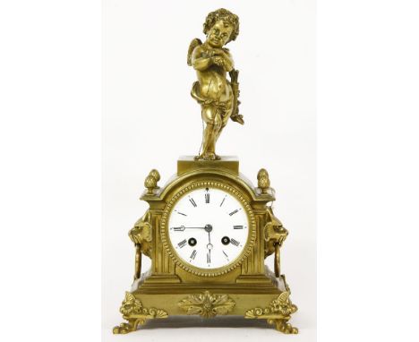 A Continental gilt brass mantel clock,late 19th century, the case with cupid surmount and lion ring handles to either side, w