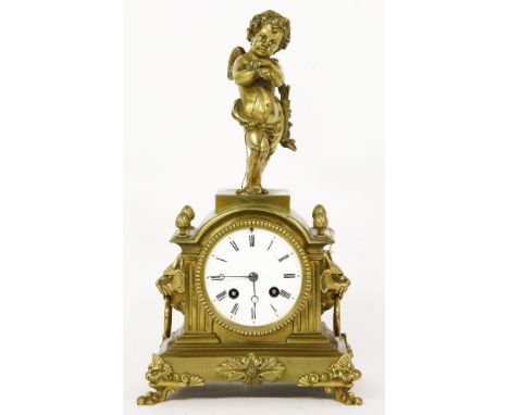 A Continental gilt brass mantel clock,late 19th century, the case with cupid surmount and lion ring handles to either side, w