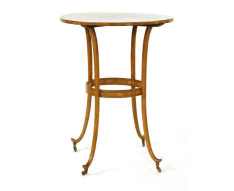 An unusual Edwardian satinwood circular lamp table,the top with strung and crossbanded borders, on turned-out splayed legs, l