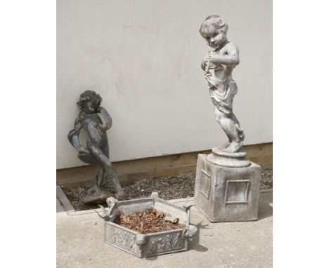 Two lead garden statues,one on an integral box plinth, 77 and 126cm high, andan hexagonal trough,applied with bird's and ram'