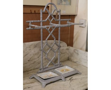 An enamelled faux bamboo cast iron stick stand W.51cm