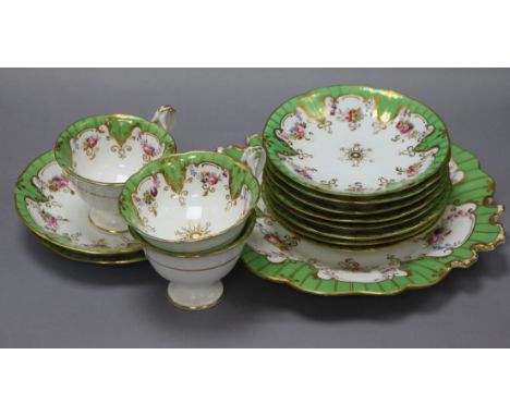 A late Victorian green border floral painted part tea service