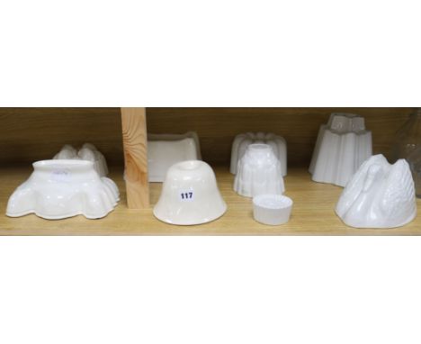 A collection of nine ceramic jelly moulds tallest 16cm