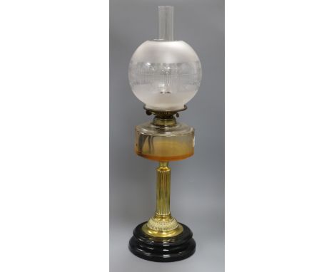 An oil lamp overall height 66cm