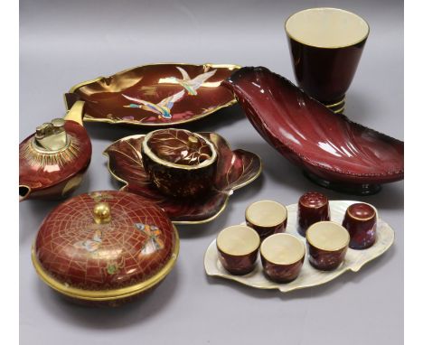 Carlton Ware Rouge Royale pottery: A powder bowl and cover, three dishes, a vase, a jar and cover, an Aladdin's lamp lighter 