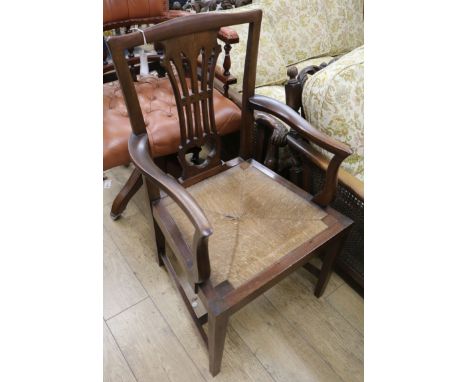 A 19th century Chippendale style elbow chair