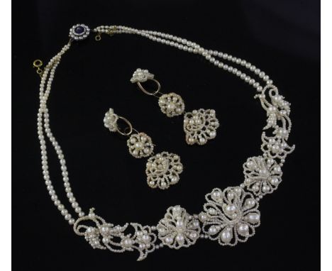 An early 19th century mother of pearl and seed pearl necklace with enamel and diamond set clasp and a pair of similar earring