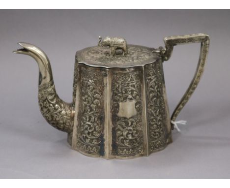 A late 19th/early 20th century Indian white metal teapot, with elephant finial, height 11cm, gross 13.5 oz.